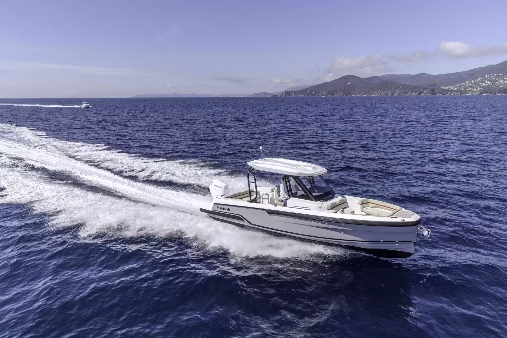 Vaartlander_Wellcraft28T-Top-6 Wellcraft 28 T-Top varend met duidelijke vaarsporen op open water